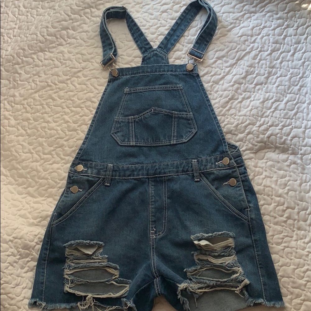 Distressed denim short overalls from Fashion Nova